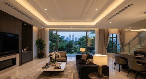Plaster ceiling with integrated hidden cooling return grilles in a landed home.